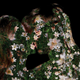 An image of a man and a woman kissing that was later made into an NFT. Their silhouettes are replaced by flowers.